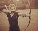 archery longbow shooter in action